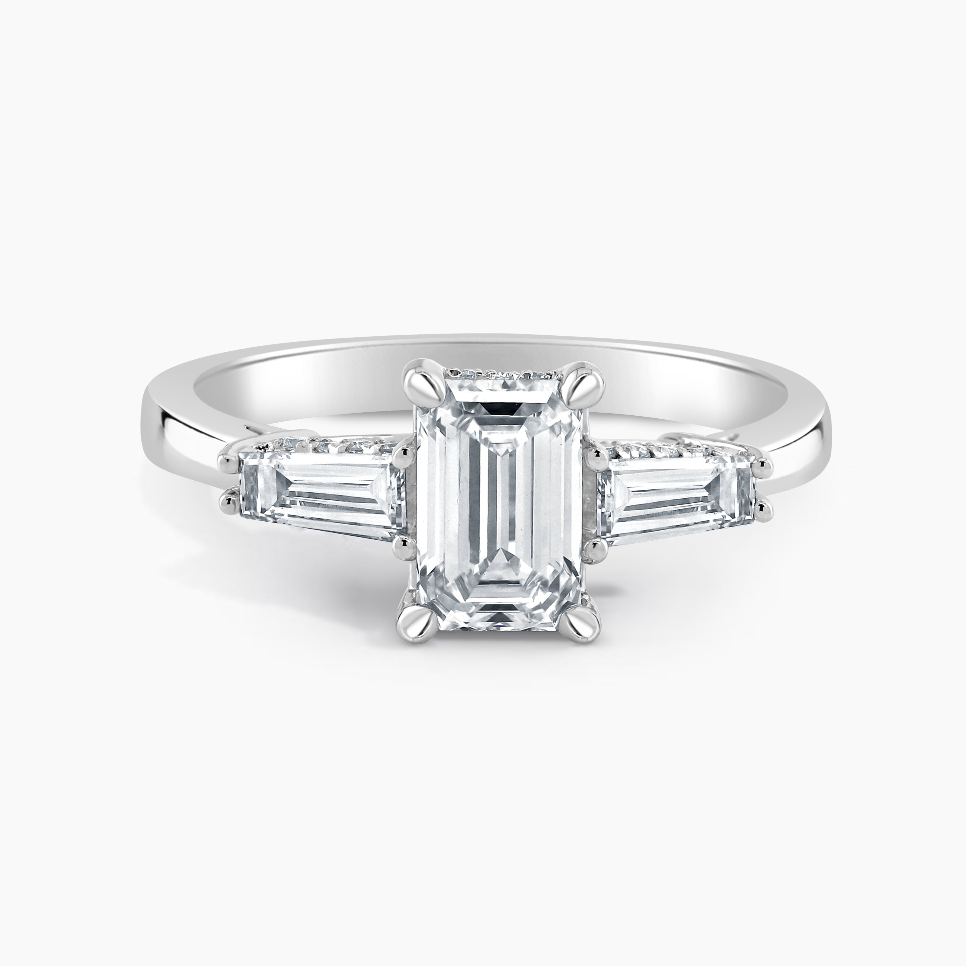 Emerald Cut Three Stone Ring With Baguettes And Hidden Halo