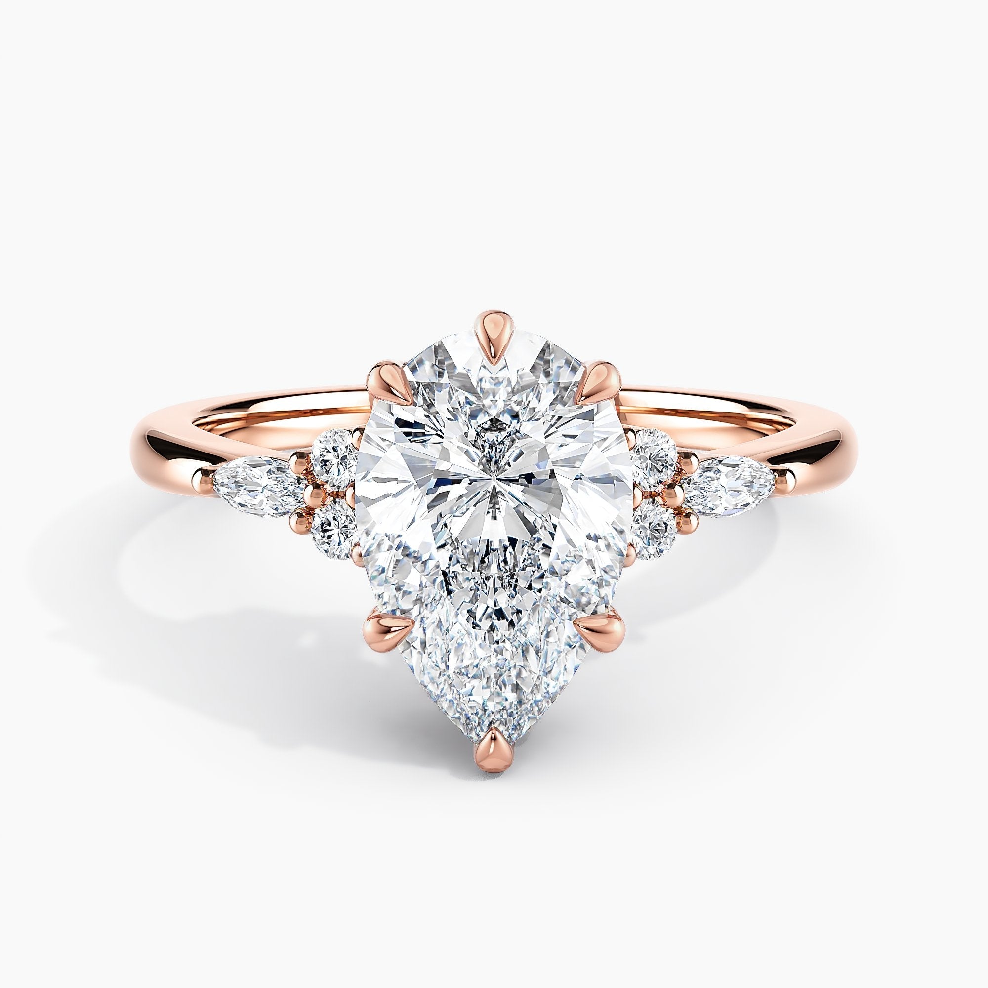 Pear Shape Nature Inspired Engagement Ring With Round And Marquise Accent Diamonds