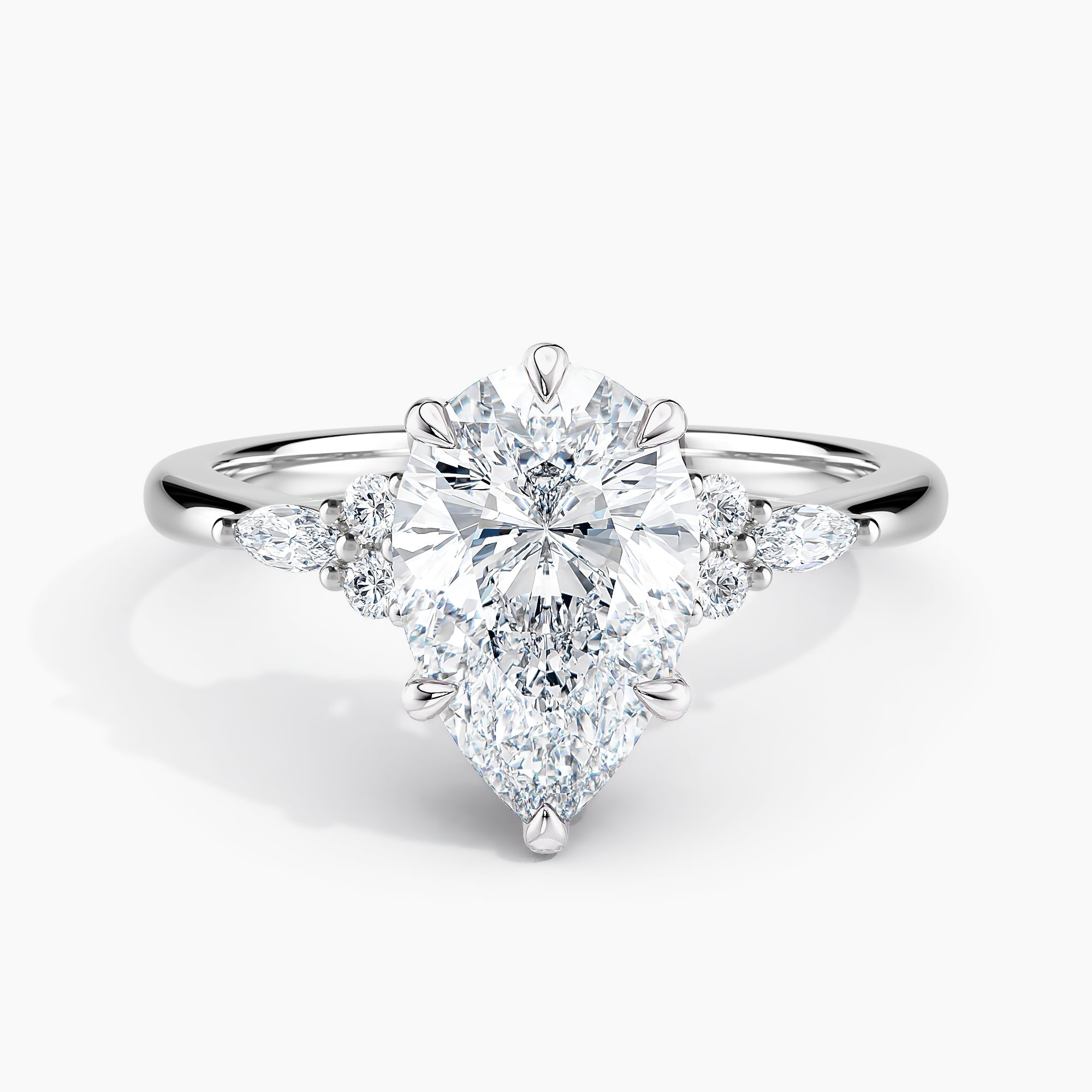 Pear Shape Nature Inspired Engagement Ring With Round And Marquise Accent Diamonds