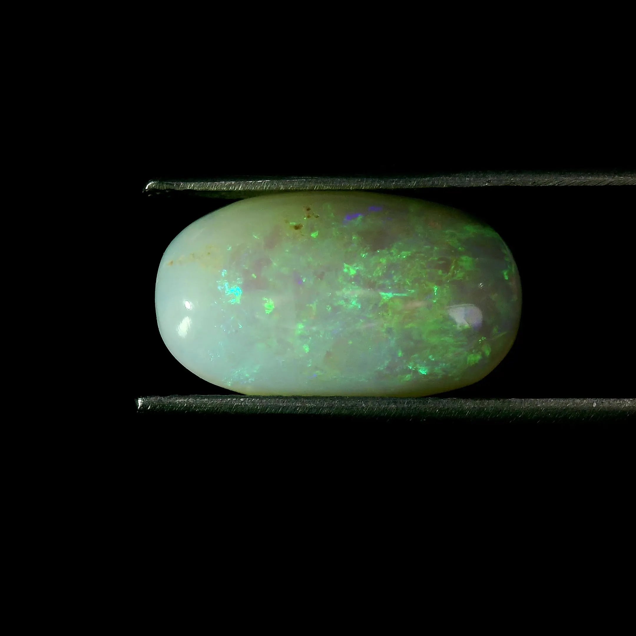 3.83ct Oval Natural Opal (Colour White, Clarity Moderately Included, Cut Cabochon)