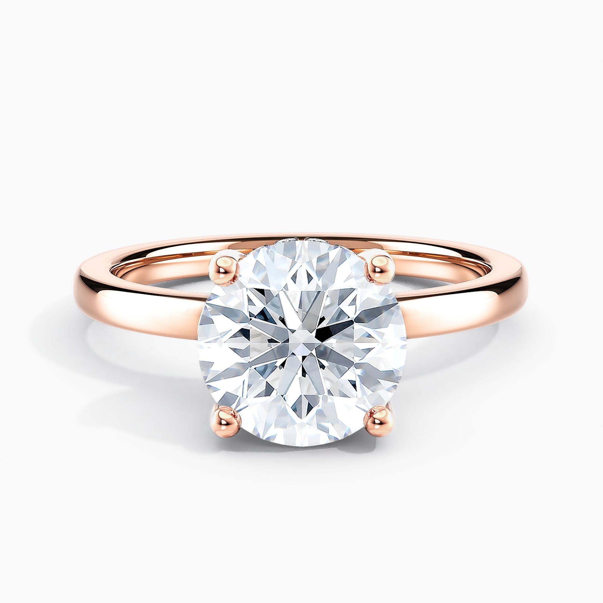 Round Diamond Solitaire Engagement Ring With Peek-a-boo Diamond Accents